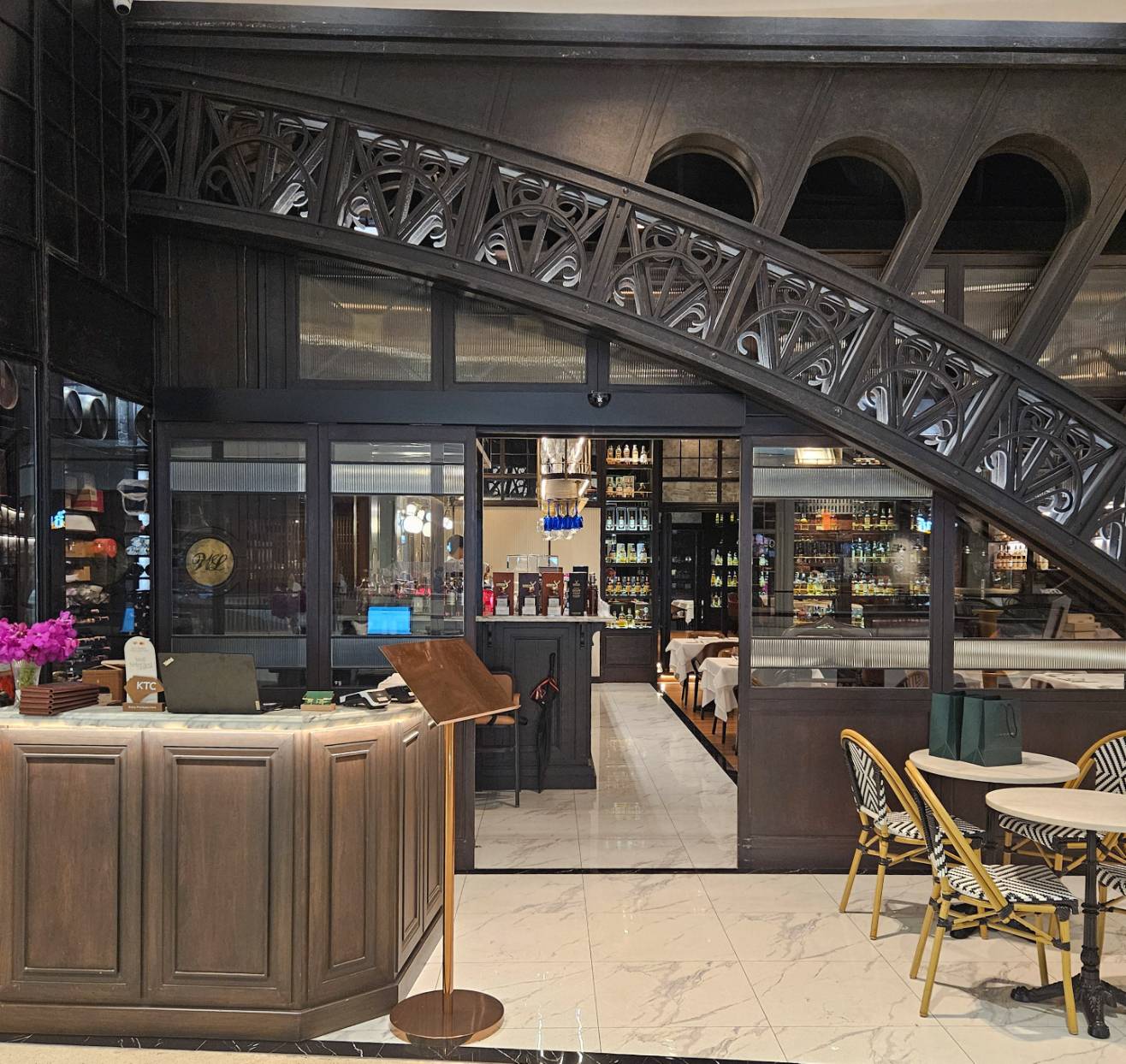 Entrance with staff greeting diners