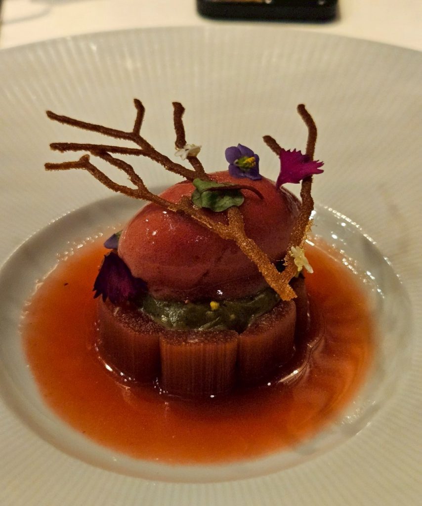 Rhubarb dessert with white peach and raspberry