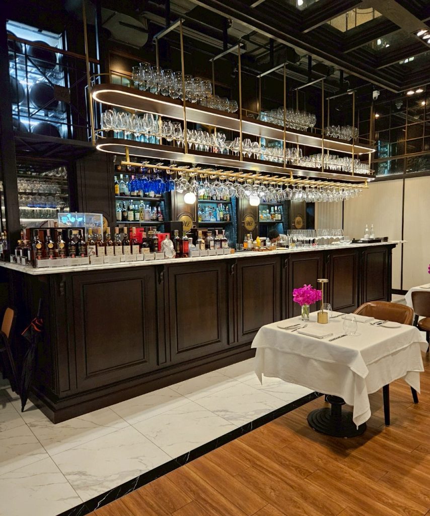 	Interior dining space at The Water Library with warm lighting