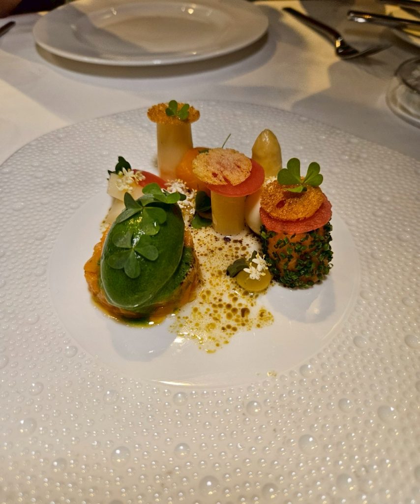 Trout with white asparagus and yuzu garnish