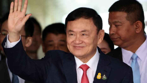 King cuts Thaksin sentence to just a year