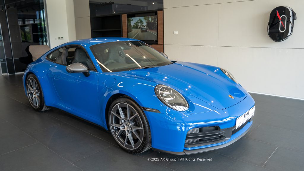 "New car delivery bay at Porsche Centre Pattaya, featuring a premium handover area for customer vehicle collection."