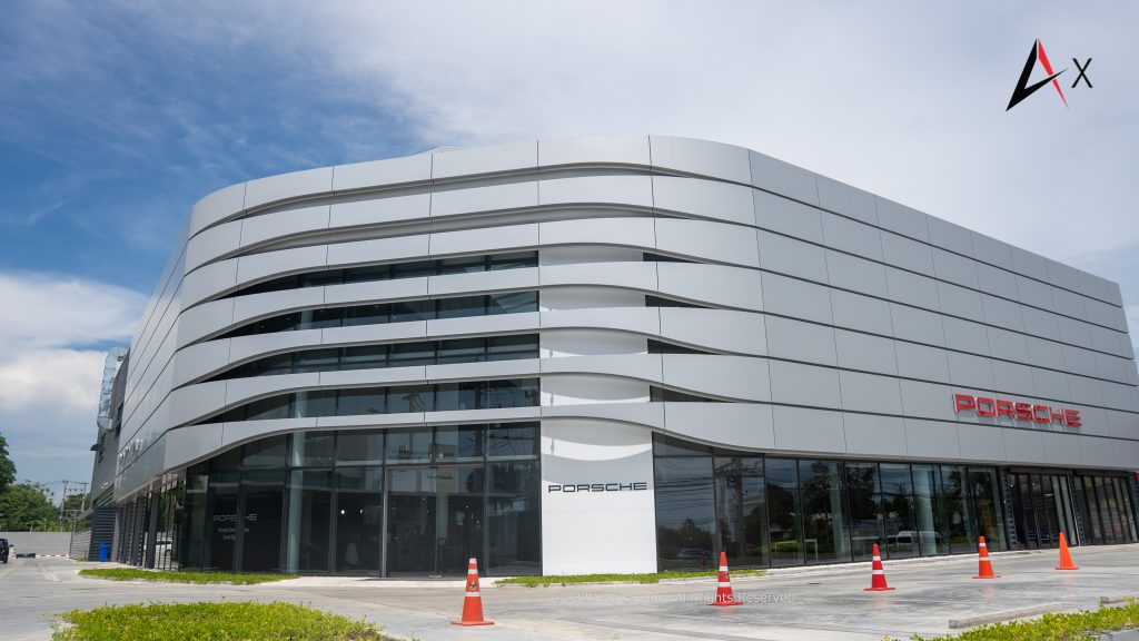 Exterior view of Porsche Centre Pattaya on Sukhumvit Road, featuring Destination Porsche architectural design and premium branding."