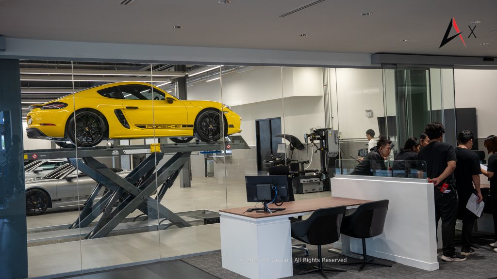 "Technician service area at Porsche Centre Pattaya with certified Porsche technicians performing diagnostics and maintenance in a clean, climate-controlled environment."