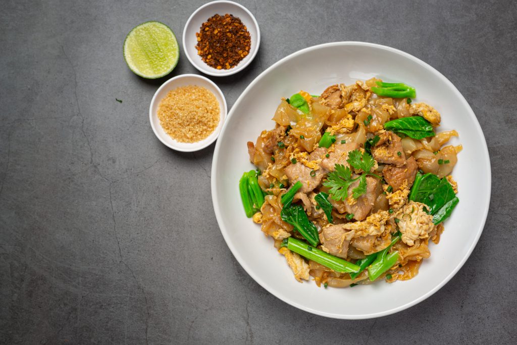 Pad See Ew stir-fried noodles with pork, egg, and Chinese broccoli