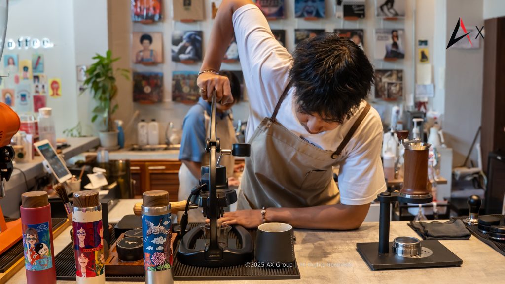 Barista preparing a specialty pour-over coffee at Recordoffee Bangkok