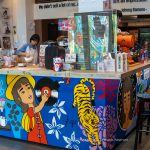 Interior of Recordoffee Bangkok with vinyl racks and minimalist café seating